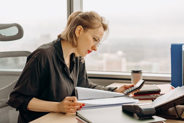 an%20accountant%20using%20a%20calculator an%20accountant%20using%20a%20calculator